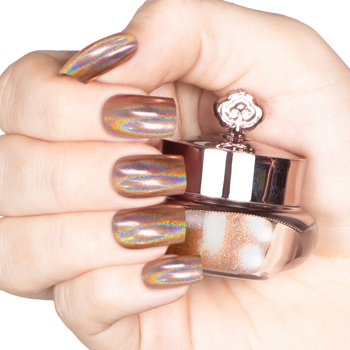 Nails featuring a champagne-gold holographic powder with warm burnt orange and brown undertones.
