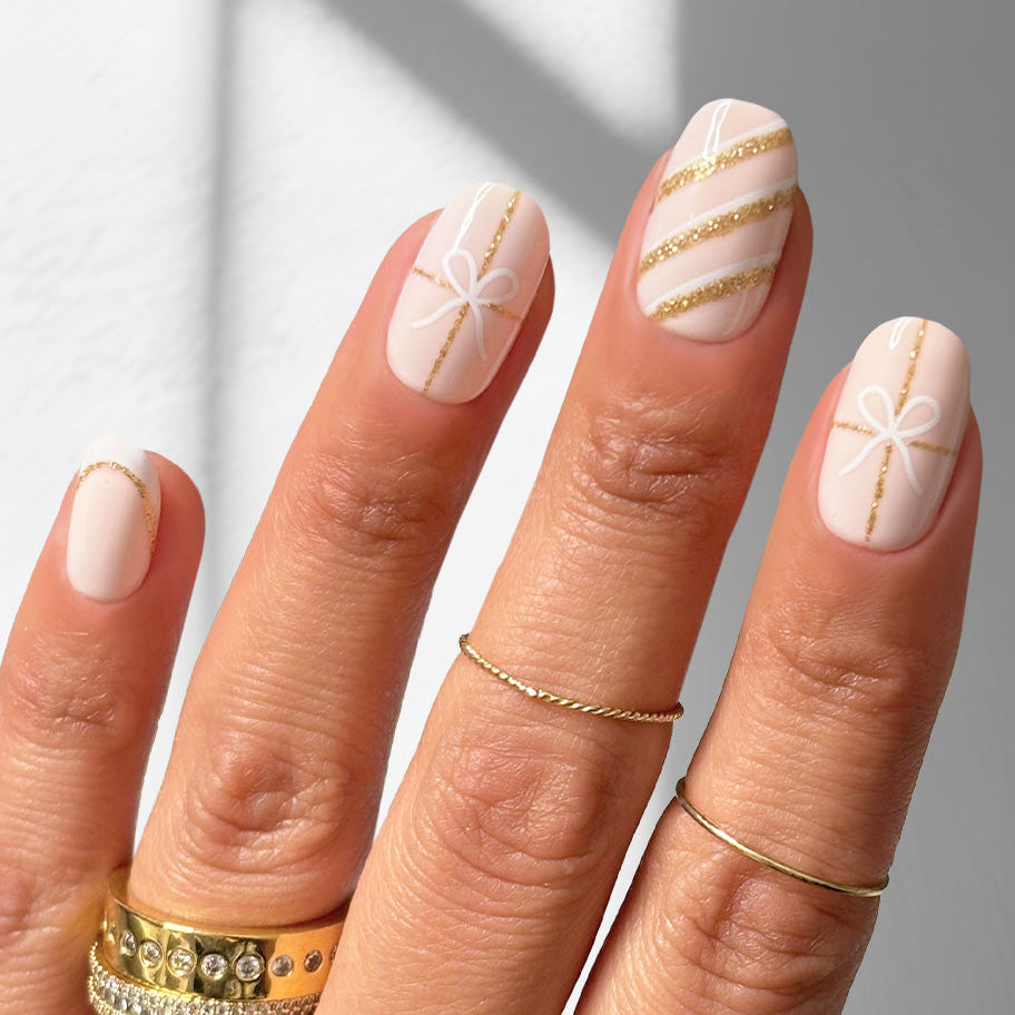 Sugar Plum Ribbon - Oval Sustainable Nails — tight close-up of the nail design